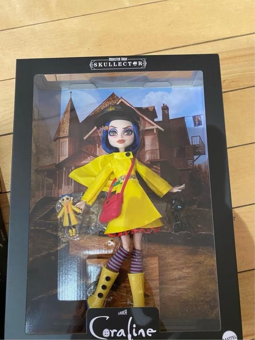 monster high Coraline Doll with Yellow Raincoat and Pink Bag
